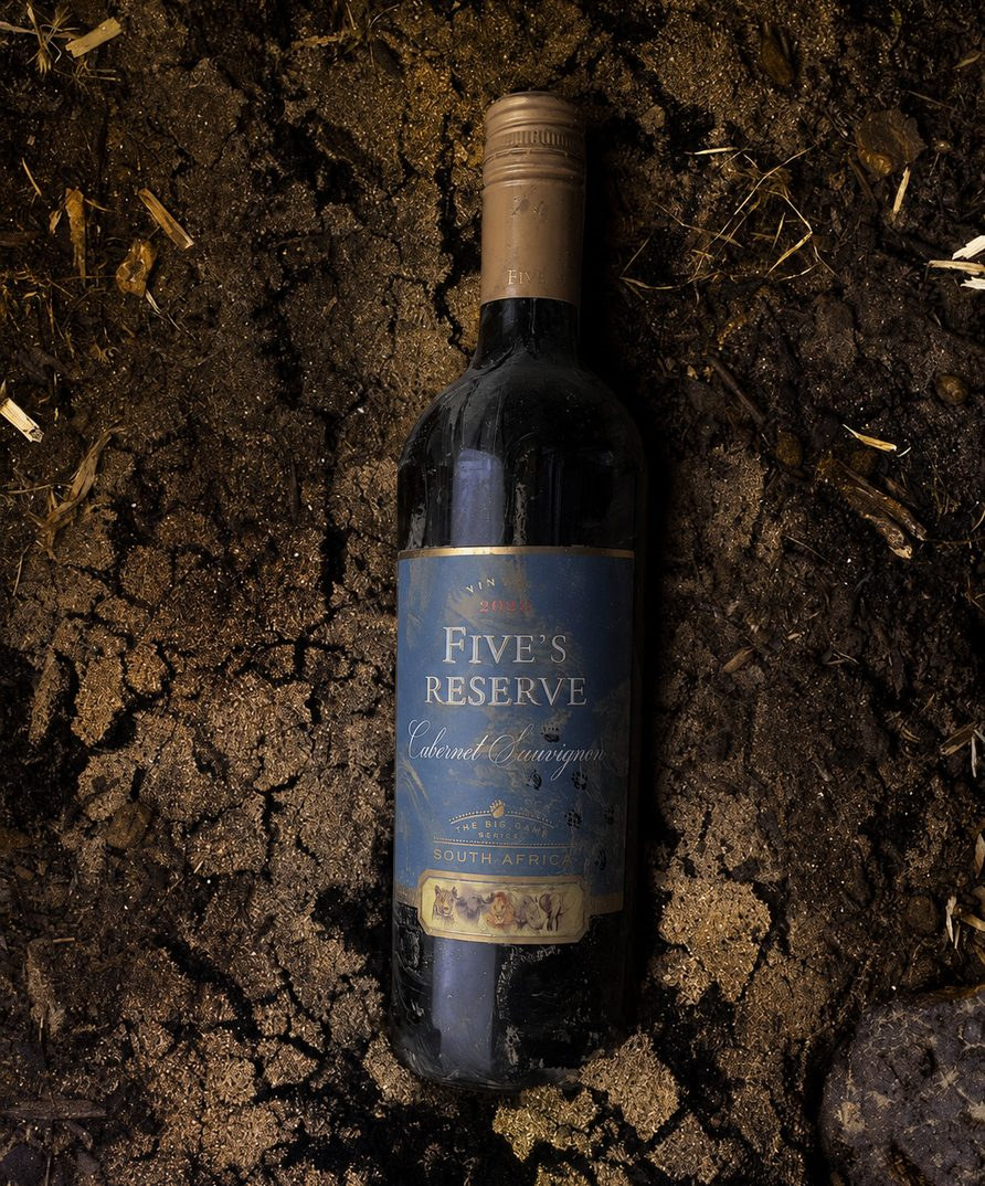 Five's Reserve bottle in the cracked flood mud
