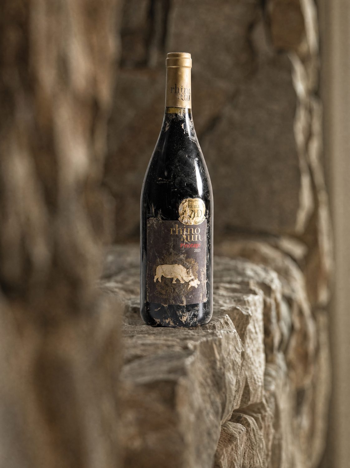 Storm-marked Rhino Run Pinotage on the stone wall